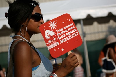 Guests kept cool with branded fans and misting stations near the entrance.