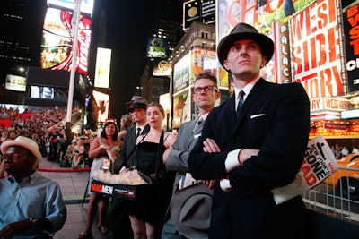 Staffers dressed as cigarette girls passed out popcorn to costumed fans throughout Sunday's screening.