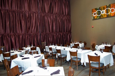 The 45-seat private dining room has one wall covered in purple silk as well as a 20-foot beamed ceiling and skylight.
