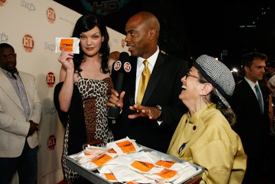 Susan Feniger's Street catered a menu inspired by global street food; actress Pauley Perrette and ET host Kevin Frazier picked up snacks on the red carpet.
