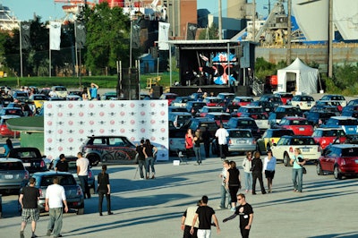 Attendees could pose for a picture with a custom Mini decorated with the company's 50th birthday logo.