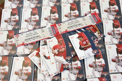 In addition to baseball cards of Nationals players, each child received two tickets to Saturday evening's game against the Milwaukee Brewers.