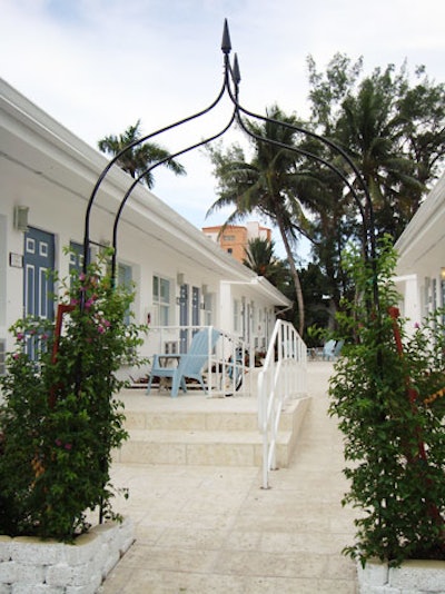 A tiled courtyard splits the two rows of sleeping rooms.