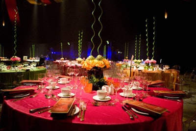 Mary Jo Sterns, executive director of the Global Event Group, topped tables with bright linens for a cirque-style event at Montreal's La Tohu Pavilion.