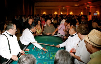 Casino games like craps, roulette, and poker filled the ballroom.