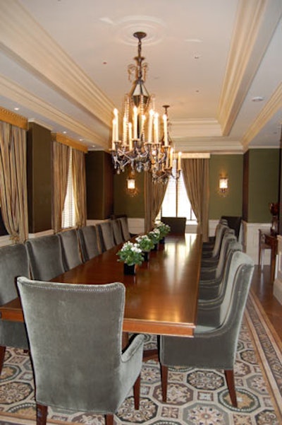 The 18-seat Parlor Boardroom is decorated with forest green silk walls and gold accents and furnished with high-back velvet armchairs.