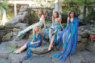 Models dressed in mermaid costumes from Malabar posed for photos beside the courtyard fountain.