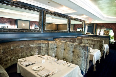 Leather and velvet furnishings fill the formal dining room on the main floor.