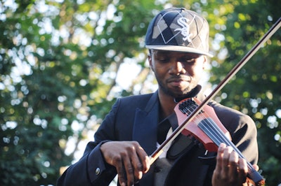 Lee England Junior, a hip-hop violinist who appears on MTV's Making His Band, performed in the courtyard during cocktail hour and onstage during the fashion show.