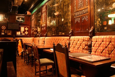 Brickell Irish Pub is decorated in a traditional style with carved wood details, heavy fabrics, and Guinness beer signs.
