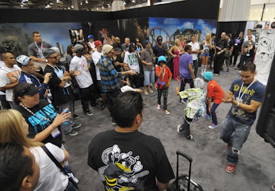 Dancing kids added energy to the show floor, which drew attendees from about 80 countries.