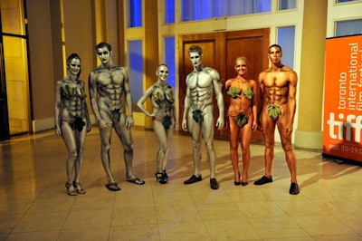 Models wearing body paint and leaves—to represent Adam and Eve—handed out apples and wine to guests as they arrived at the gala.