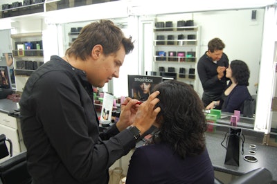 Shawn Hlowatzki, director of artistry for Smashbox Cosmetics, offered touch-ups inside the trailer, which is filled with new products from the company's Reign collection.