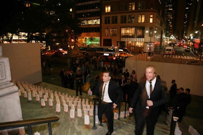 On the steps leading up to the library, Paper placed hundreds of LED candles inside white paper bags.