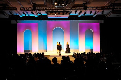 On the fashion show's set, three arches framed an illuminated backdrop.