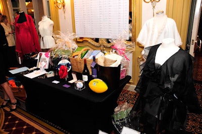 During the cocktail reception, guests bid items ranging from wine to autographed baseballs and clothing.