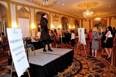 In the ballroom's foyer, models displayed furs that guests could win in the raffle.