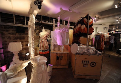 The lower level of 54 Crosby Street is decorated like the basement of someone's home with furniture wrapped in dustcovers and boxes stuffed with newspapers.