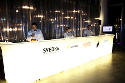 The main bar featured logos and drinks from the evening's drink sponsors, including Svedka, Sapporo, and Coca-Cola.