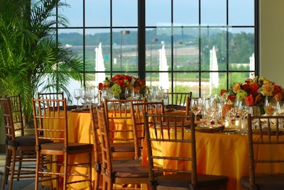 Floor-to-ceiling windows offer views of the Potomac River and Wilson Bridge.