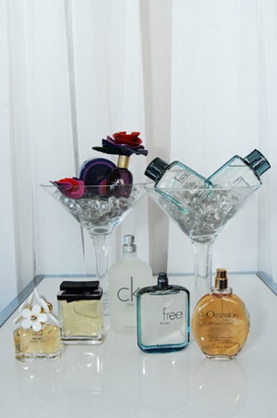 Fragrances from sponsors Marc Jacobs and Calvin Klein fill oversize martini glasses at a display in the lounge.