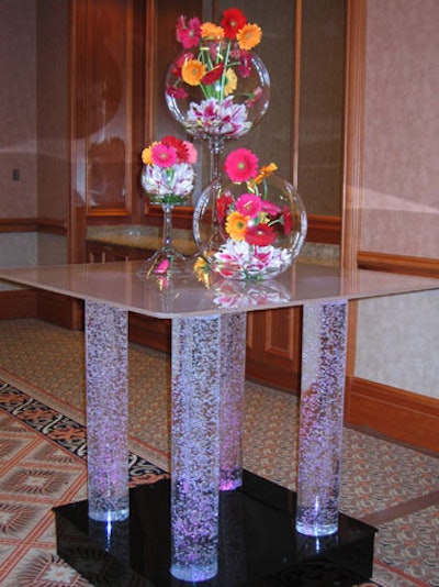 Bright gerbera daisies added splashes of color in glass vessels.