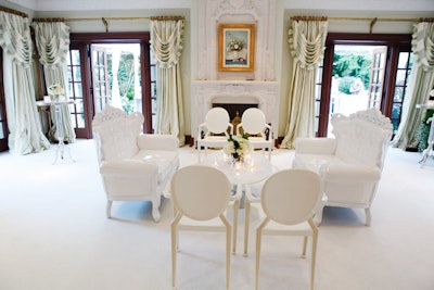 White flowers and furnishings filled a room at the home of Edward Rogers, the site of Sunday's OneXOne fund-raiser.