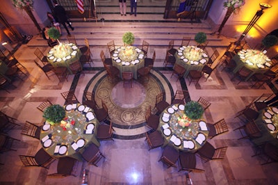 Produced by Campbell Peachey & Associates, the dinner portion of the event used tables draped in green linens with brown bamboo chairs.