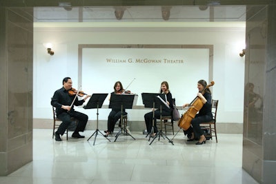 The four-piece Cherry Blossom string quartet performed in front of the theater during the reception, in the rotunda near the Charters of Freedom during dinner, and under the portico after dinner.