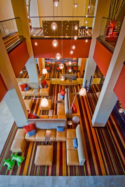 The soaring, contemporary lobby has lots of seating options and workstations equipped with high-definition TVs.