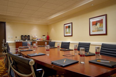 The boardroom holds 12 for a conference or dinner.