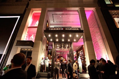 The red carpet and step-and-repeat took up half a city block, adjacent to the store's uplit facade.