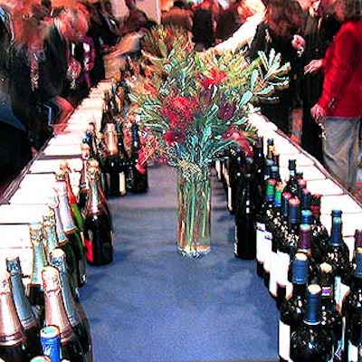 A long buffet table covered with wine and spirit sets were also part of the silent auction.