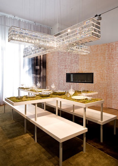An ode to a storyline involving a stolen fluorescent crucifix, architect James Biber used a cross-shaped table and mirrored it with four Swarovksi chandeliers in a Weeds dining room.