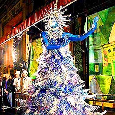Mirena Rada created the couture Christmas tree costume with sparkling silver and blue tulle for the Saks Fifth Avenue holiday window unveiling. (Photo by Martha Cooper)