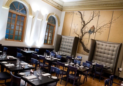 Two murals by artist Doug MacRae provide a focal point in the main dining room.