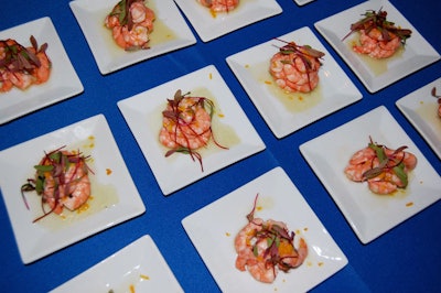 Walk-around tasting stations at the aquarium offered dishes such as chilled citrus-poached shrimp with fresh melon, mint emulsion, and micro chives.