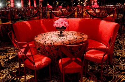 The design team used a palette of red, black, and taupe throughout the party.