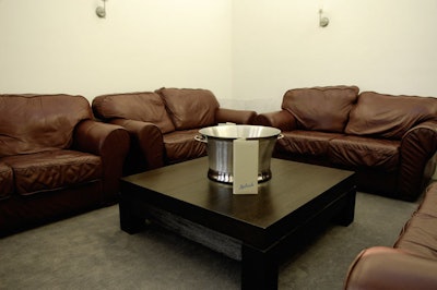 The V.I.P. lounge on the first floor has overstuffed couches and a flat-screen TV.