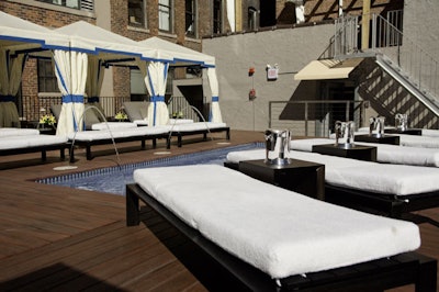 Splash's roof deck has private cabanas, a decorative fountain, a DJ area, and a full bar.