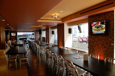 Connecting the upstairs area with Bon Appétit's lower level, LG's flat-screen televisions broadcast the action in the kitchen.