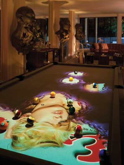 Inside the eighth-floor penthouse of the luxury SoHo Mews condo building, Esquire's pop-up has 9,200 square feet of space and is outfitted with Obscura Digital's Cuelight pool table.