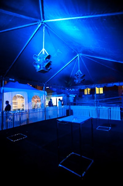 The tented outdoor portion of the party overlooked the purple carpet entrance and included hanging streetlights.