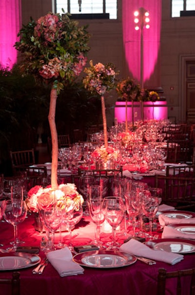 So as not to block anyone's view of the stage, only the tables lining the perimeter of the room featured topiary centerpieces topped with hydrangea.