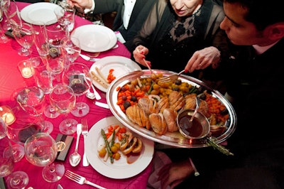 The evening's peach-glazed guinea fowl entree was presented French service style so guests could help themselves to heirloom potatoes, green and white asparagus, carrots, and beets.