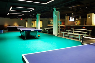 Within Spin New York's 13,000-square-foot facility is a central court area, where 15 ping-pong tables are surrounded by bleacher seating.