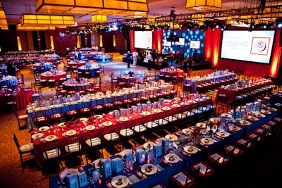 Guests dined at long tables where everyone could watch the auction's progress on large screens.
