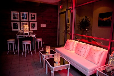 White furnishings and mirrored tables from Lounge Rentals Inc. filled a space known as the Glass House, on the fifth floor of the Spoke Club.