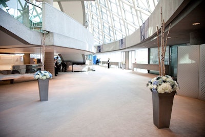 Blue-and-white floral arrangements from Tidy's Flowers were positioned throughout the lobby at Roy Thomson Hall for the T.S.O.'s opening night gala.