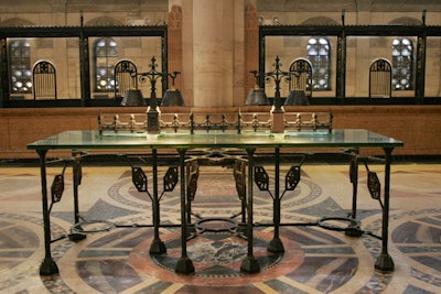 Glass-topped tables run down the center of the venue's main room.